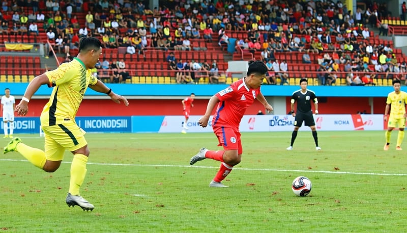 Indonesian football match in action Indonesian football match in action